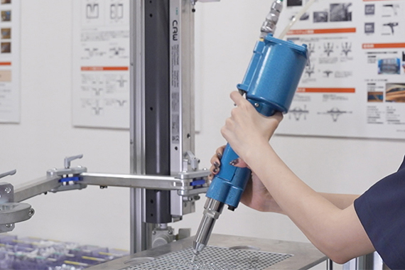 Repetitive riveting work posed challenges for operator burden and quality stability.